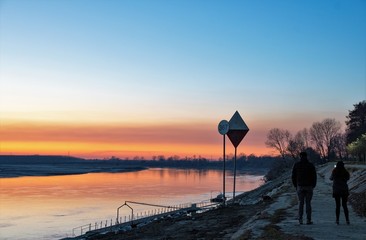Two people by the river