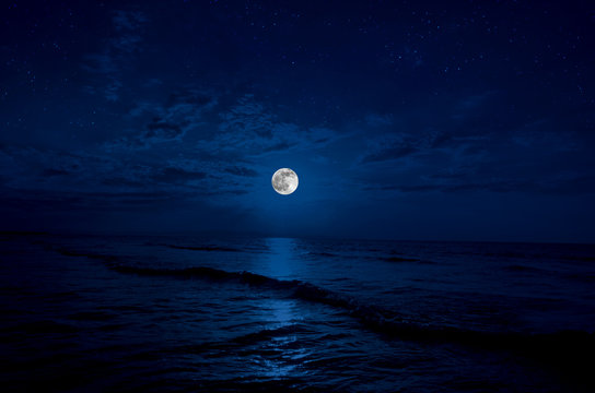 Full moon rising over sea at night with copy space. big full moon reflecting in a sea. Azerbaijan