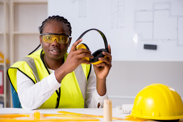 Young black architect working on project 