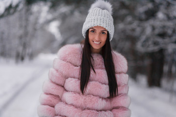 A girl with a beautiful smile on a winter walk