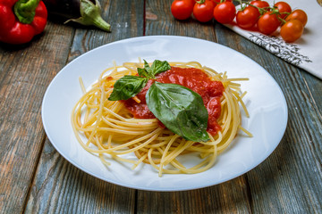Spaghetti with vegetables in tomato sauce