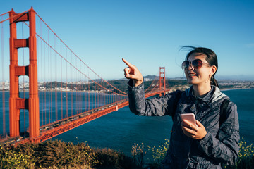 girl tourist excited pointing at blue sky