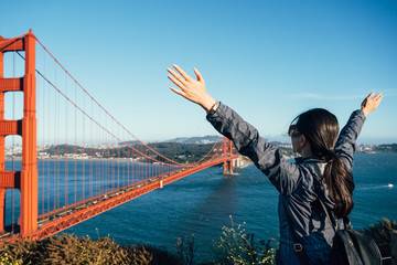 happy female people tourist at Golden Gate Bridge