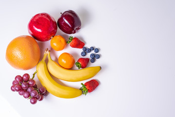 Organic Fresh Fruits on white background with copy space.