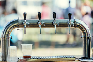 Close-up of craft beer taps