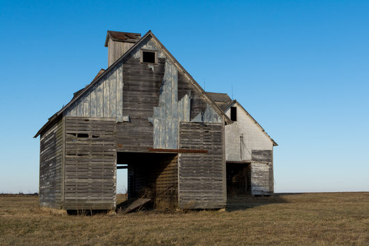 Old wooden barns in the open farmland.  LaSalle County, Illinois, USA