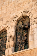 Cross design on window in Old City Jerusalem, Israel