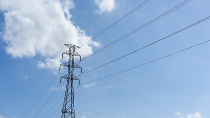 electricity pylon on blue sky and clouds