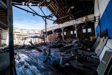 Abandoned gymnasium, kids football pads, score board numbers