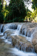 Fototapeta na wymiar Beautiful limestone waterfall in lampang Thailand 