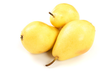 Three ripe yellow pear fruits isolated on white background.