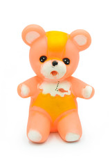 Vintage rubber toy bear on white background