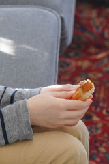 Boy eating grilled cheese sandwich.