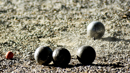 Hit the petanque ball in the petanque field.