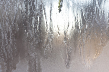 Texture of frozen glass. Light background