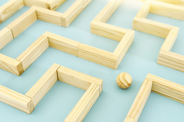 concept photo of standing in a maze and looking for the best way or solution.