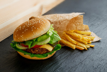 Chicken Burger with French Fries Garnish on Black Stone