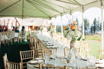 empty plated tables set for a wedding celebration dinner