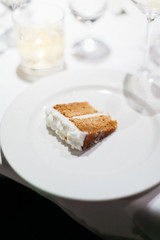 small slice of cake sitting on a plate on a table