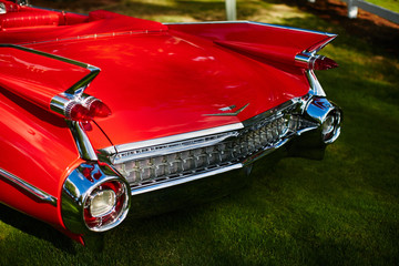 back view of a red cadillac de ville
