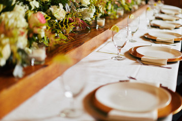 empty plated tables set for a wedding celebration dinner