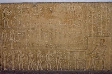 Egyptian ancient hieroglyphs on the stone wall