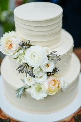 beautifully decorated wedding cake waiting to be eaten