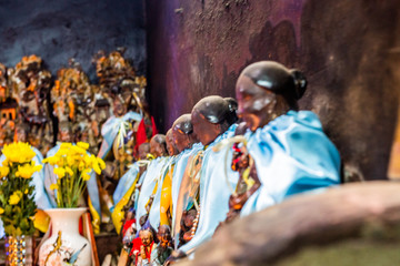 offering to statues in a chinese temple