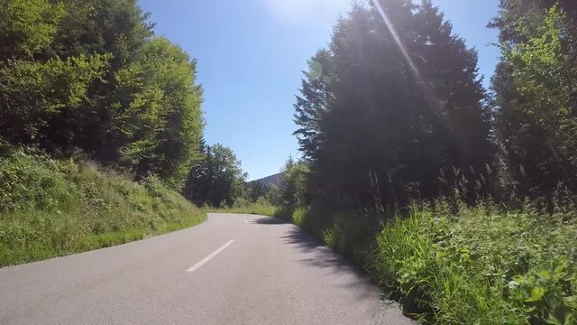 Motorcycle curves driving on mountain roads by motorbike through summer landscape in the Black Forest. Includes two different video sequences!