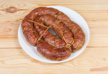 Baked homemade turkey sausage curtailed by a rings