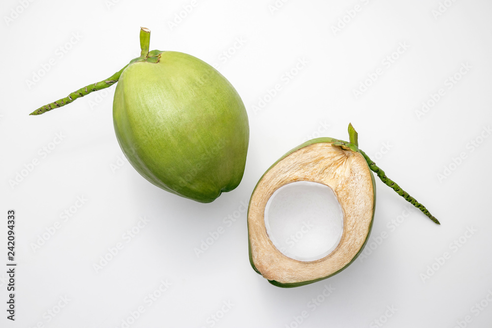 Wall mural Fresh young coconuts on a white background, creative flat lay healthy food concept, top view with clipping path