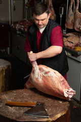 The chopping the meat, professional work of the butcher