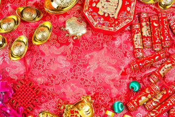Chinese new year festival decorations, ang pow or red packet and gold ingots. Chinese characters...