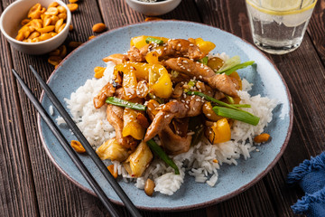 Kung Pao chicken, stir-fried Chinese sichuan traditional sichuan  dish with chicken, peanuts, vegetables and chili peppers.