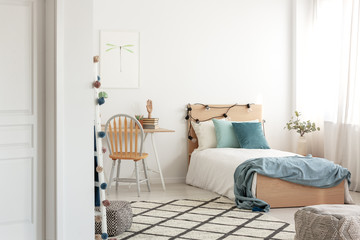 White and wood scandinavian kid's room with comfortable single bed and workspace with desk and chair - obrazy, fototapety, plakaty