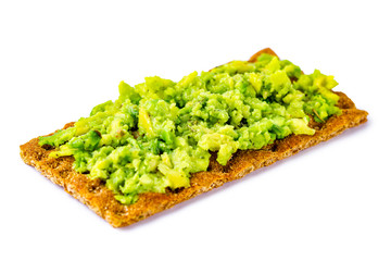 Crisp rye bread with avocado cream isolated. Avocado sandwich on a white background