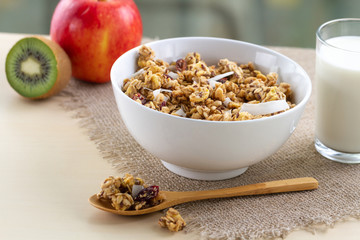 Dry breakfast cereals. Crunchy honey muesli bowl with flax seeds, cranberries and coconut and a...