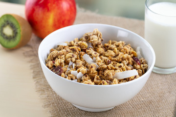 Dry breakfast cereals. Crunchy honey muesli bowl with flax seeds, cranberries and coconut and a...