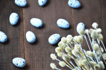 Easter background with willow branches and eggs.