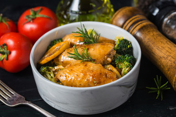 Grilled chicken wings with vegetables and herbs