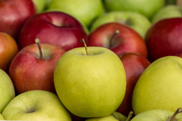 Close up of fresh golden, red and green apples