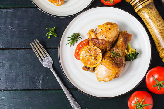 roasted chicken legs with vegetables and herbs
