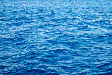Obraz premium Blue pool water with sun reflections