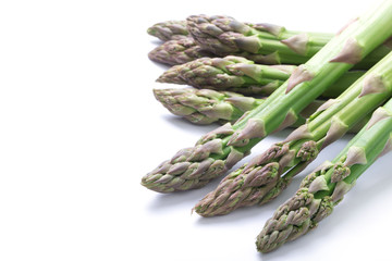 Fresh green asparagus on white