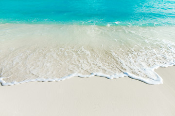 tropical Maldives island with white sandy beach and sea