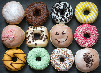 Doughnuts donuts various types of cakes abstract fat thursday concept
