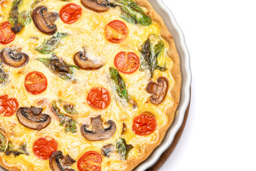 Baked homemade quiche pie in ceramic baking form