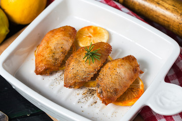 Grilled chicken wings with vegetables and herbs
