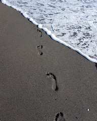 Fussabdruck im Sand am Meer