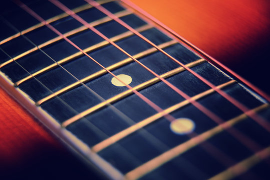 Guitar neck and strings close up